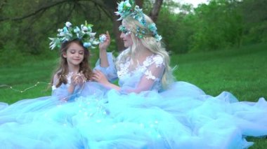 Slow Motion The princesses are dressed in luxurious long dresses