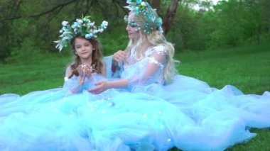 Slow Motion Woman princess in family look blue dress long train medieval