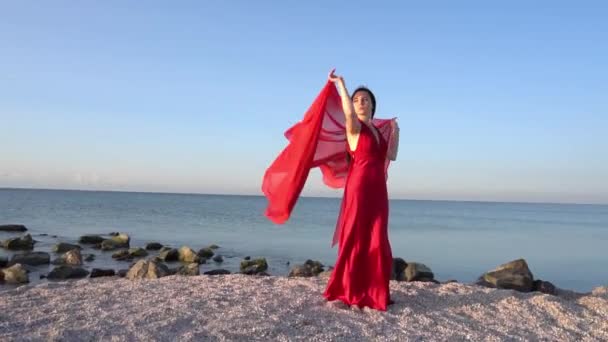 Woman Posing Red Dress Long Train Standing Sea — Stock Video