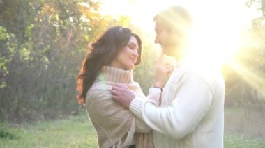 Slow Motion Lovers hand in hand in autumn park