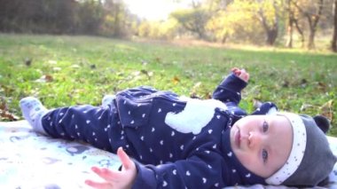 Slow Motion little baby in sunny autumn park