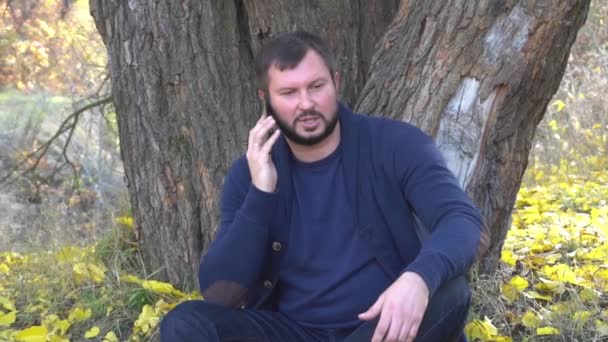 Slow Motion Handsome Man Talking Phone Autumn Forest — Stock video