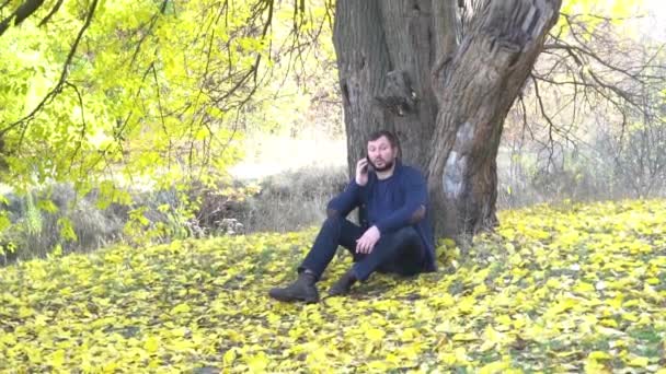 Slow Motion Man Talking Phone Nature Autumn Park — Video