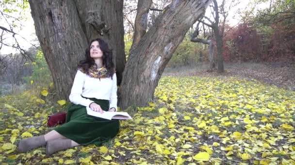 Slow Motion Women Sits Tree Book Her Hands Season Autumn — Stock Video