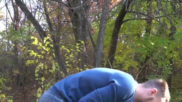 Young Handsome Father Holding His Little Son Sunny Autumn Forest — Video