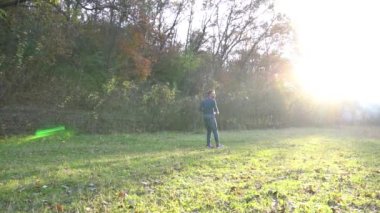 Slow Motion Young man throwing frisbee in park