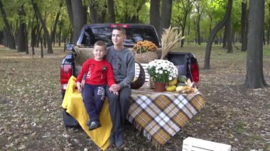 Slow Motion Trick or trunk. Children celebrating Halloween in trunk of car. 