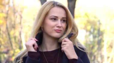 Attractive young woman in an autumn setting