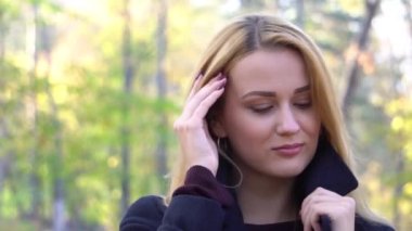 Slow Motion Portrait of pretty nice girl in autumn park