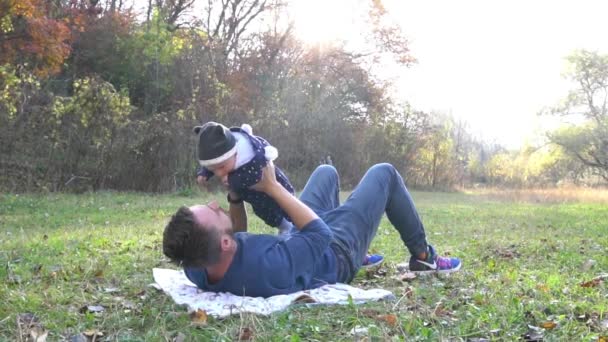 Slow Motion Handsome Father Relaxing His Son Colorful Autumn Nature — Stockvideo