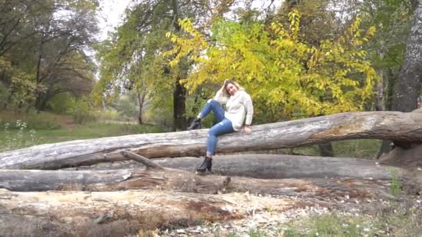 Slow Motion Girl Sits Autumn Park Blonde — Stock Video