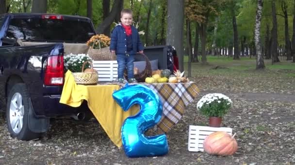 Cheerful Funny Baby Boy Trunk Car Decorated Halloween — Vídeo de Stock