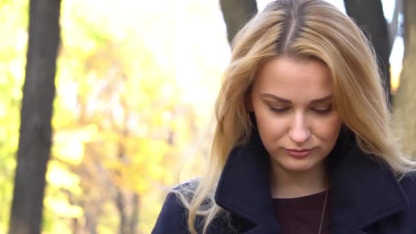 Blonde Woman Cover Face Yellow Maple Tree Leaves Bouquet Watching — Video