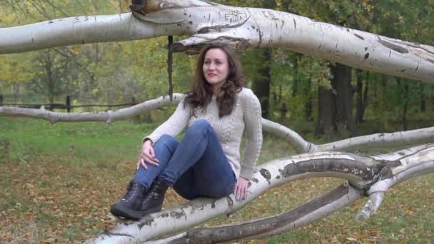 Slow Motion Girl Sitting Tree Forest Autumn Time — Vídeo de stock