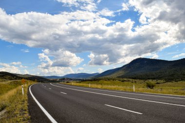 Country main road fading into the mountain distance, Thredbo Valley clipart