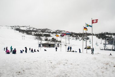 School children having fun in the snow at Smiggins Hole clipart