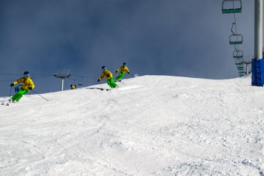 Female skier carving down an Australian ski slope clipart