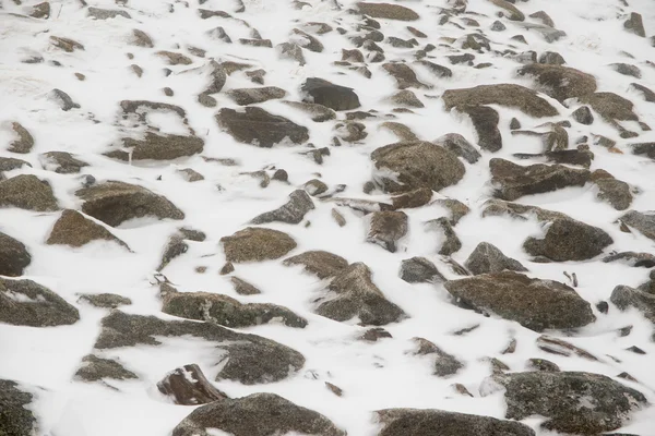 Large granite rocks partially covered by snow and ice — Stock Photo, Image