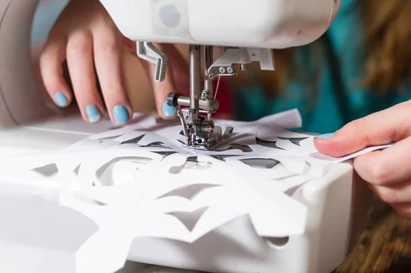 Sewing New Years toys. Making Christmas toys. Christmas toy factory. Preparing for the new year. The girl sews. — Stock Photo, Image