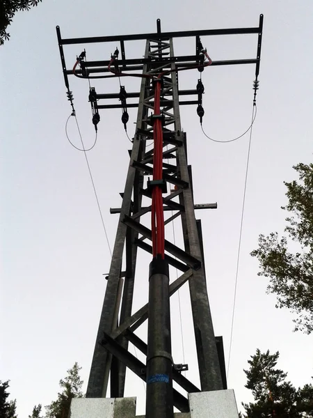 Power line in front of the sky.