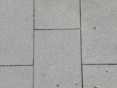 Açık gri karenin arkaplan dokusu ve pürüzsüz beton kaldırım