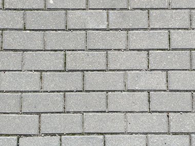 Tuğla desenli gri beton dikdörtgen kaldırım taşlarının arkaplan dokusu