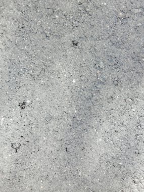 Açık gri asfalt veya ince taneli asfaltın dikey arkaplanını kapat