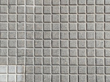 Yukarıdan görünen gri beton kare kaldırım taşlarının arkaplan dokusu