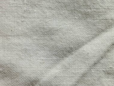 Beyaz ya da açık gri örülmüş kumaş dokusu katlanmış ve kırışmış arka plan