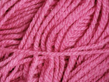 Parlak pembe örgü ipliği ya da yün dokusunu kapat.