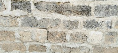 Gri granit taşın üzerindeki beyaz havan dokusu yakın plan.