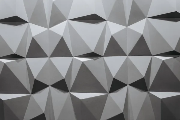 abstract wallpaper or geometrical background consisting of black and white geometric shapes: triangles and polygons