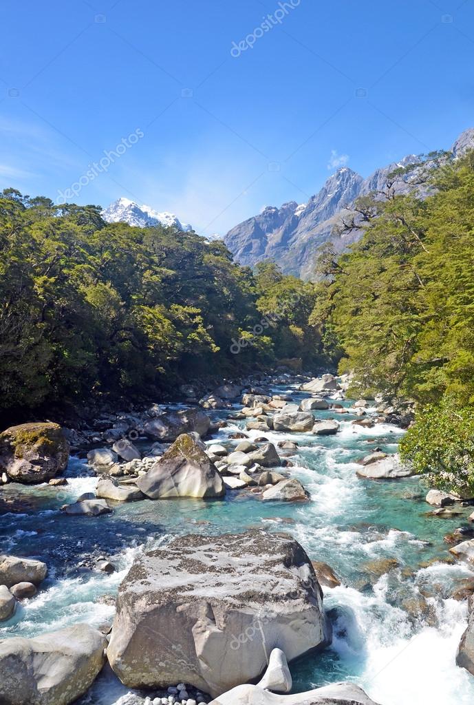 Alpine river in pristine wilderness — Stock Photo © KHBlack #112874778