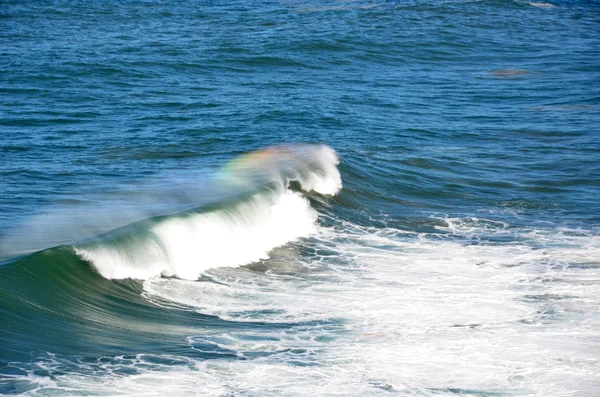 Rainbow on a wave — Stock Photo, Image