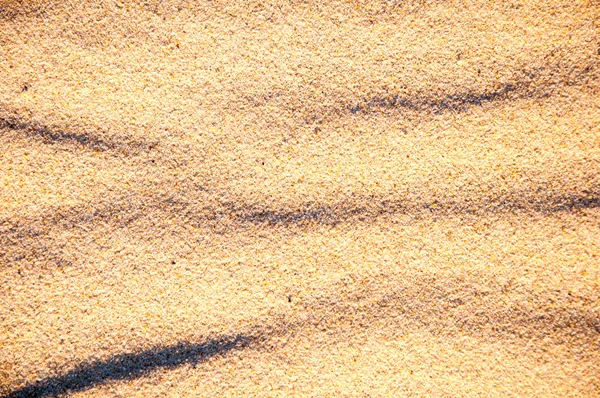 Крупный план песчаного рисунка пляжа летом — стоковое фото