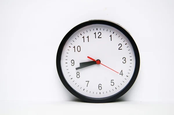 Black clock isolated on white background — Stock Photo, Image