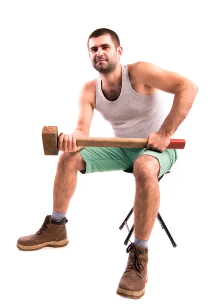 A man with a hammer on a white background — Stock Photo, Image