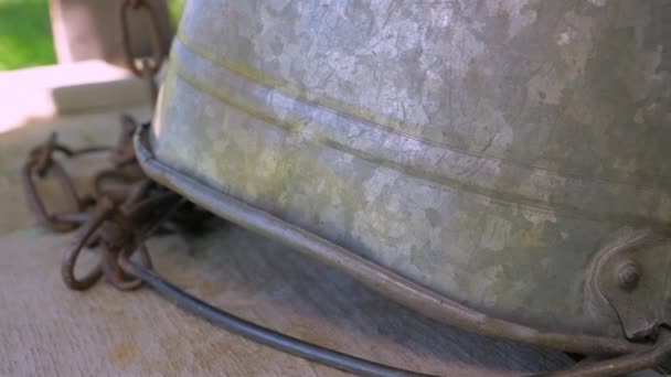 The closer look of the metal bucket on top of the old well in Estonia — Stock Video