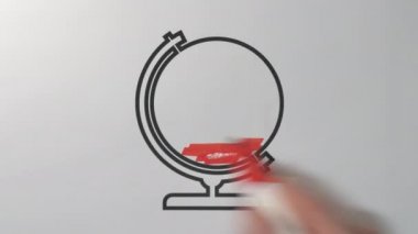 Kırmızı renkli kalem bir animasyon fikri üzerine dünyayı boyuyor.