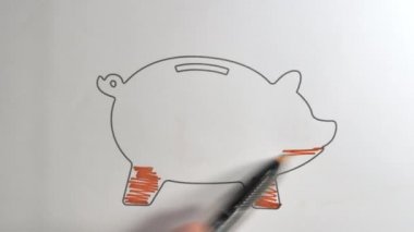 Kırmızı kalem domuz kumbarasının resimlerini gölgelemek için kullanılır.
