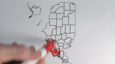 The vertically oriented map of the USA on the paper