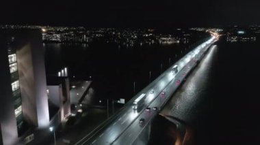 Beautiful aerial shot of a busy bridge crossing the sea in Helsinki.