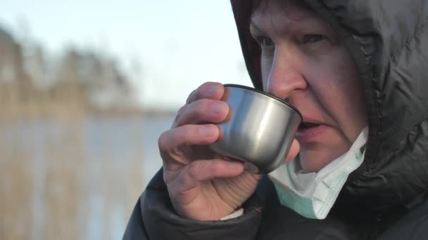 Closer look of the silver cup with drinks in Finland — стоковое видео