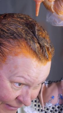 Putting on the dye chemicals on the hair.