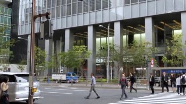 People crossing the pedestrian lane in the streets of Tokyo Japan