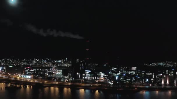 Beautiful aerial shot of a smoking chimney in Helsinki on a moonlit night.mov — Stok video