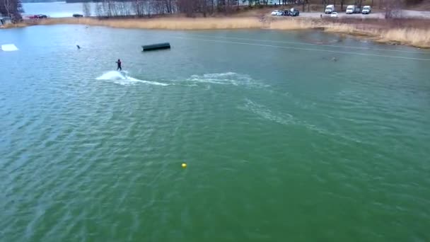 A man surfing in the bay area in Helsinki Finland — Video