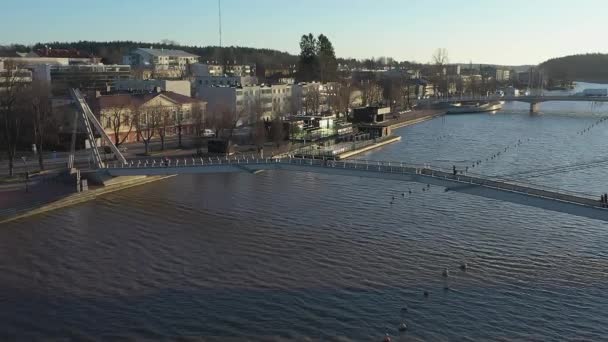 Idyllic aerial shot of a bridge crossing the river in Porvoo Finland. — Stock Video