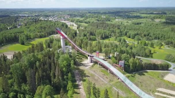 Idyllic drone point of view of a ski jumping tower in Estonia on a sunny day. — Stock Video