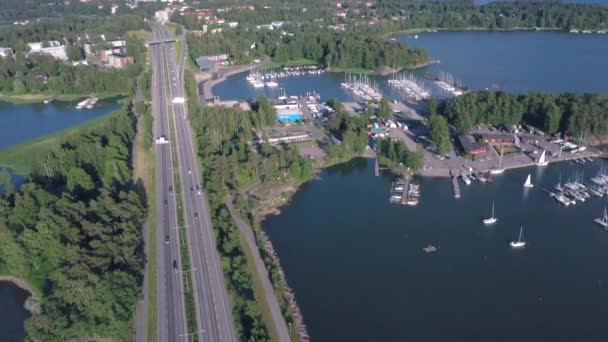 Aerial view of the cars passing through bridge in Lauttasaari in Helsinki. — Stock Video